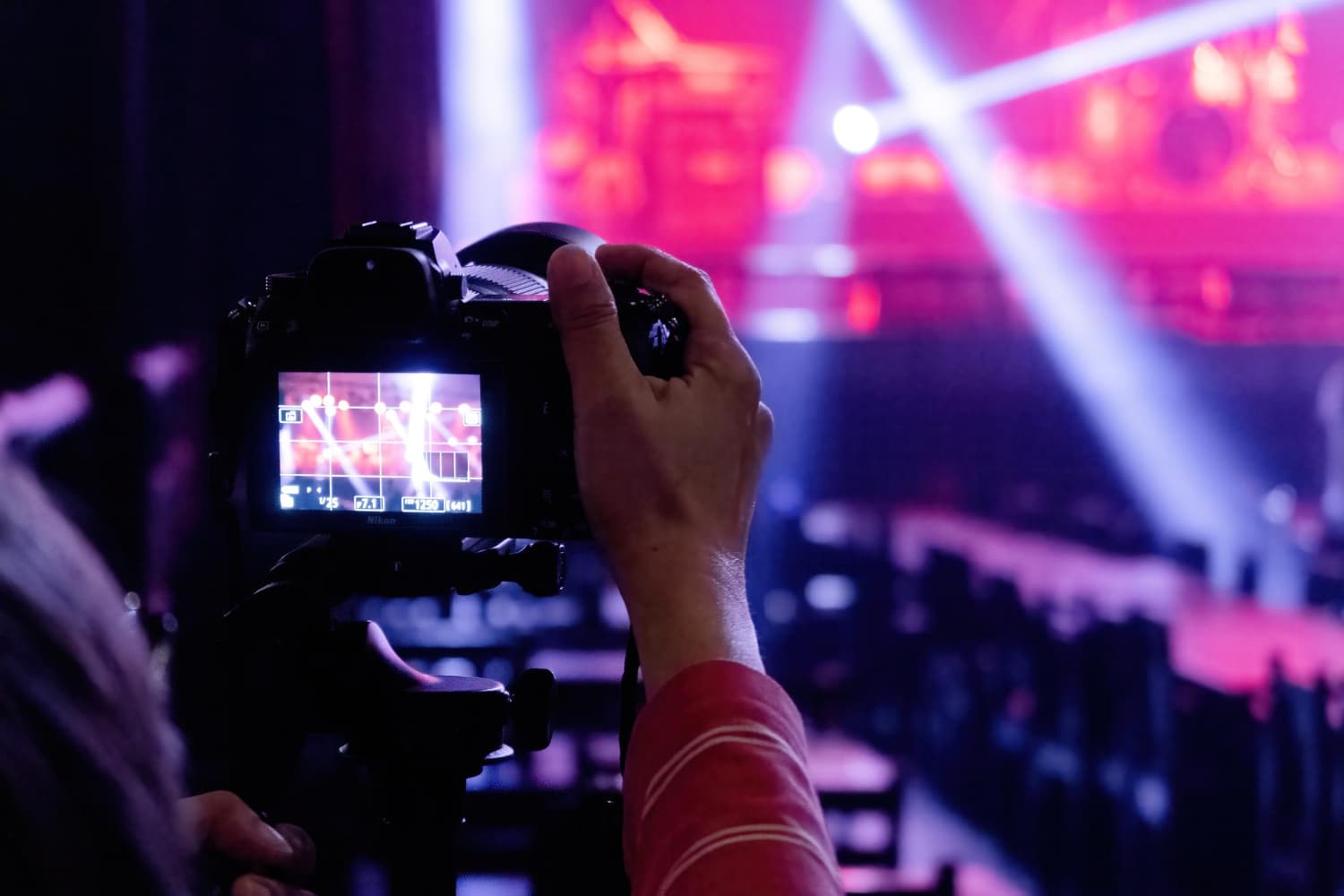 A camera filming a live event